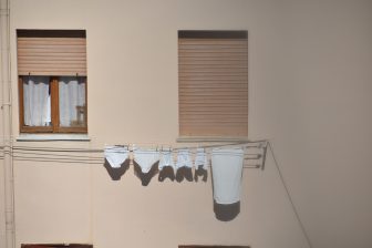 Italy-Sardinia-Alghero-laundry-window-shadow