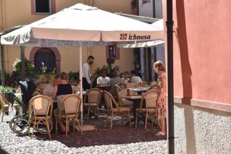 Italy-Sardinia-Bosa-restaurant-Locanda di Corte-outdoor tables-people