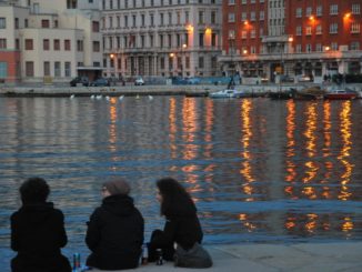 Italy, Trieste – couple and setting sun, Feb. 2014