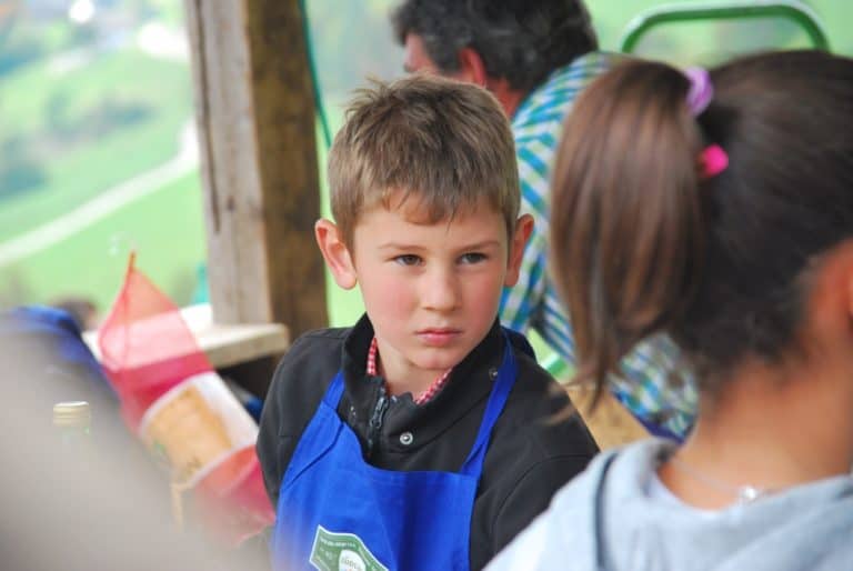 Italy, Santa Maddalena – boy looks at girl, Oct.2014 (South Tyrol)