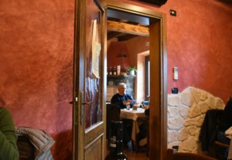 a room with the red wall in the restaurant, Trattoria Clementina in Sirmione