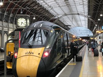 England-London-Paddington Station-platform-train-clock-people