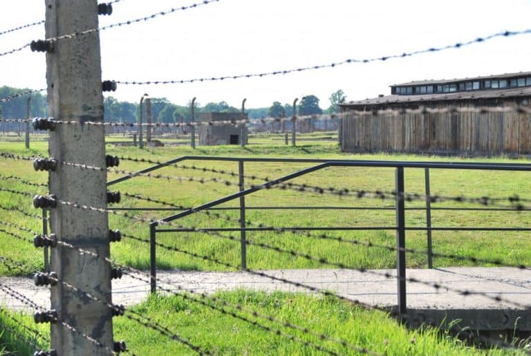Poland, Birkenau – barbed wire and wooden hut, May 2009