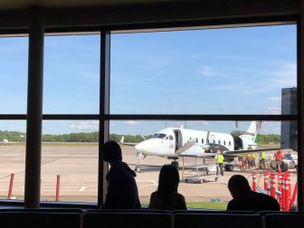 Canada-Prince Edward Island-airport-small airplane-window-people