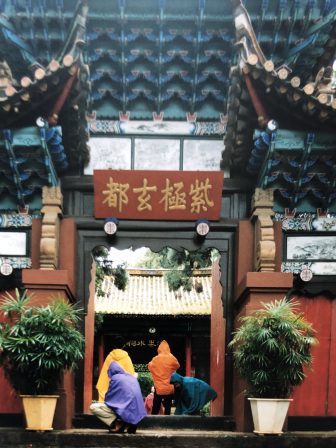 China-Kunming-city tour-people-raincoat-colours