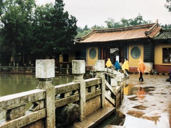 China-Kunming-city tour-Gailong Palace-rain-people