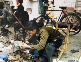 China-Lanzhou-Ding Xi Nan Lu-market-shoe repair-woman