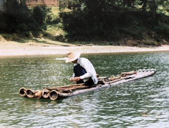 China-between Yangshuo and Xingping-Li River-a man-working-raft