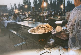 China-Turpan-street food market-stew-table-people