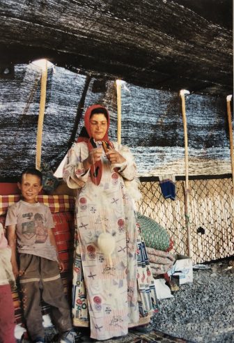 Iran-Semirom-Qashqai people-woman-spinning-boy