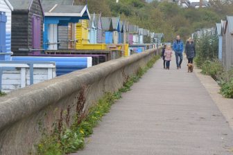 England-Whitstable-beach huts-road-people