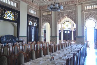 the long tables and chairs inside the Palacio de Valle