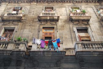 a building with windows and the laundry in Havana in Cuba