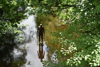 the standing figure seen from Stockbridge