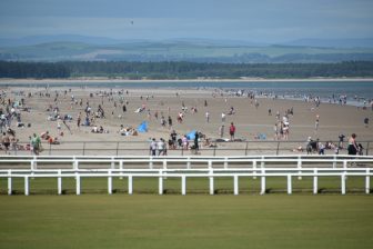 the beach with many people in St. Andrews