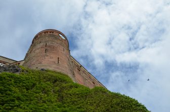 looking up at Bamburgh Castle in Northumberland