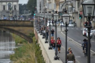 streetlights in a row along the Arno River