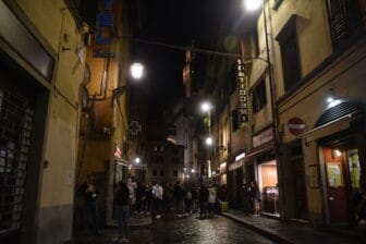 a street with many young people at night