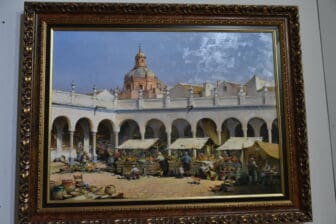 Un quadro che rappresenta la piazza del mercato di Carmona