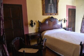 a bedroom of a mansion, Casa Palacio de Palma in Ecija