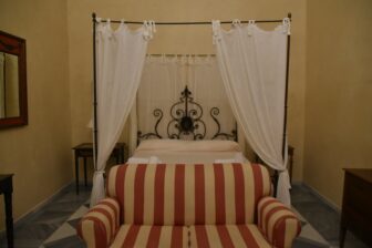 the bed in the suite of the hotel of Palacio Marques de la Gomera, a mansion in Osuna