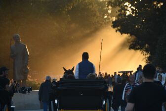 a carriage and people at Plaza de España in Seville