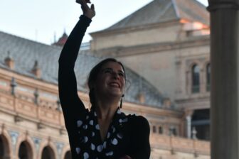 a flamenco dancer at Plaza de España in Seville