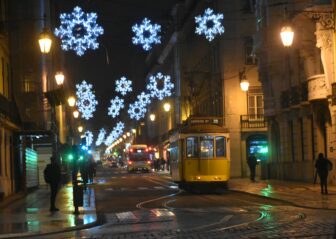 tram and decoration seen from Comercio Square in Lisbon
