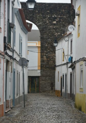 the Agua de Prata Aqueduct and houses in Evora