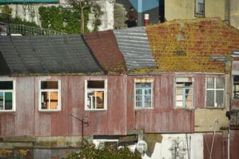 the decaying houses seen from the bridge in Oporto