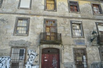 a shabby house on the hill overlooking Douro River