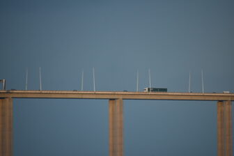 cars passing Vasco da Gama Bridge of Parque das Nacoes in Lisbon