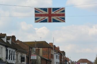 a large flag above the street in Marlow, England