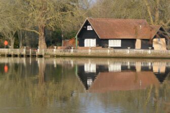 beautiful reflections on Thames River seen from while walking from the bridge in Marlow, England