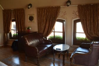 the spacious room with sofas in Boris Palace, the hotel in Plovdiv