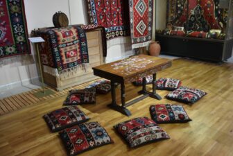 a corner of the Chiprovtsi museum room with kilims 