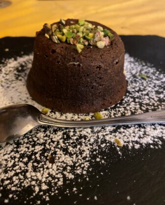 the chocolate fondant at Antica Trattoria Ferrari, a restaurant in Pavia, Italy