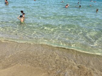 clean water with many fish at Lido Arenella beach near Syracuse