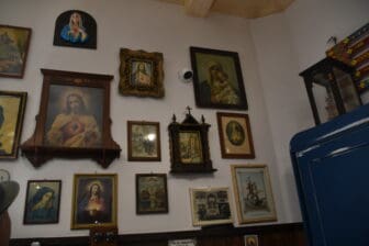 pictures on the wall of Osteria dei Sapori Perduti, a restaurant in Modica, Sicily