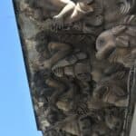 the intricate carvings under the balcony seen in Modica in Sicily