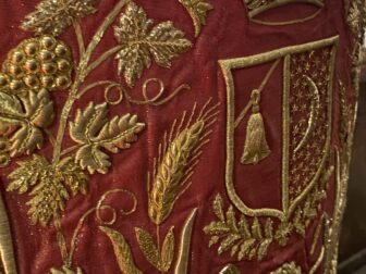 detail of a priest's gown with embroideries in St. Peter's Church in Modica, Sicily