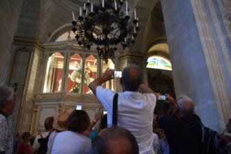 the group of tourists taking photos of San Giorgio on the horse in Duomo in Ragusa Ibla, Sicily