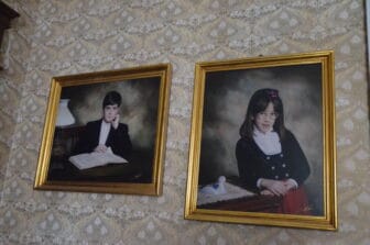 the portraits of younger generation of Arezzo on the wall of the Baron's mansion