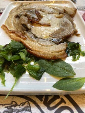 Porchetta of La Taverna di Rugantino, the restaurant of Roman cuisine in the northern Italy