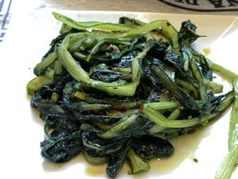 chicory at La Taverna di Rugantino, the restaurant of Roman cuisine in the northern Italy