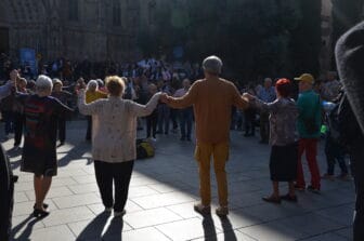 elderly people dancing Sardana dance in Barcelona, Spain