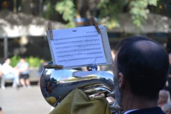 a person playing the music for Sardana dance in Barcelona, Spain