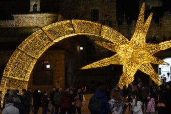 many people at Plaza Mayor at night in Caceres, Spain