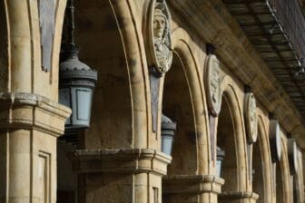 a row of busts surrounding Plaza Mayor in Salamanca, Spain