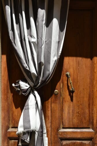 the curtain outside the door seen in Castelfiorentino in Tuscany, Italy